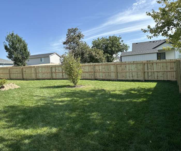 Cedar wood privacy fence installation